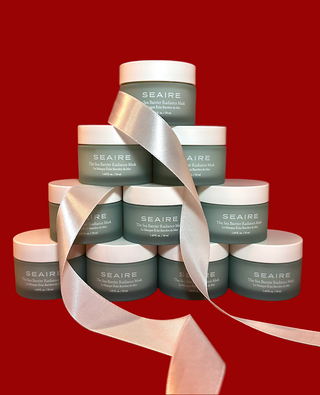 Stack of SEAIRE jars with a red background